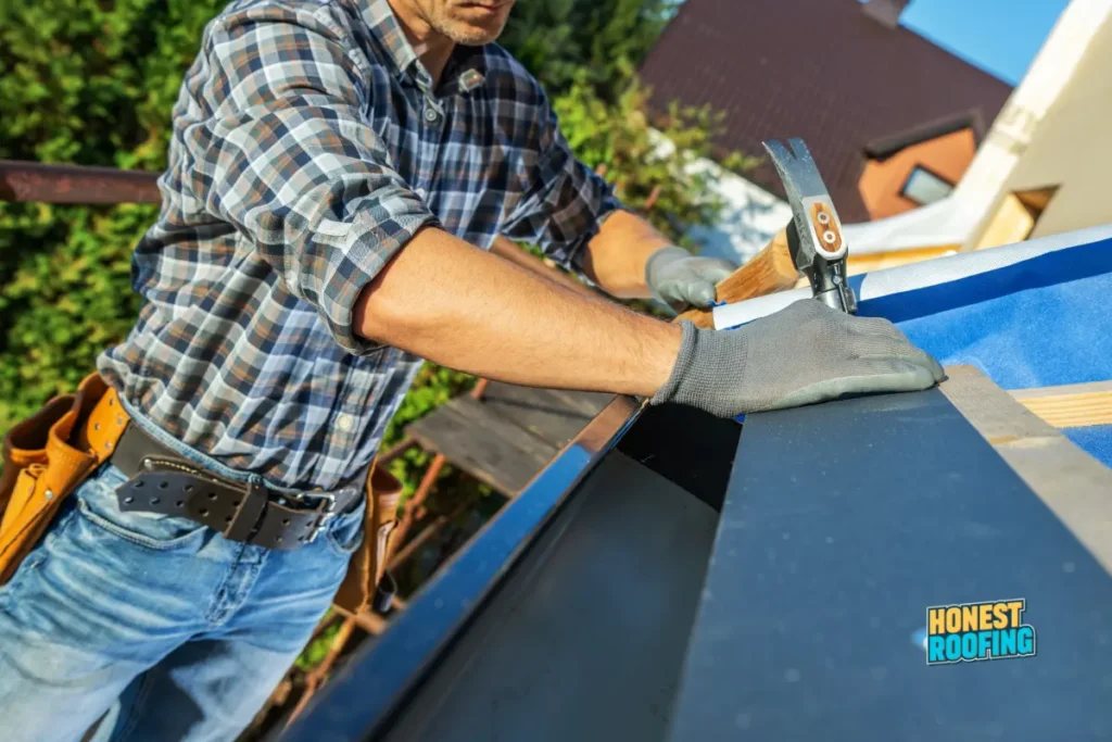 Honest roofing company — skilled roofer nailing flashing on a residential roof showing professional workmanship