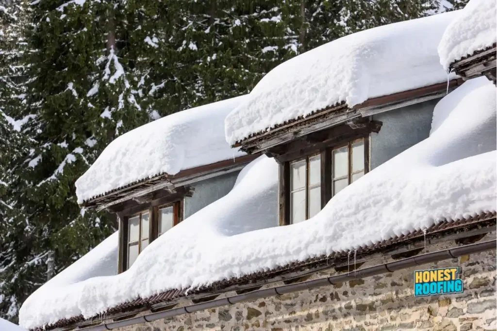 roofing insights — heavy snow and ice buildup on a residential roof before winter preparation