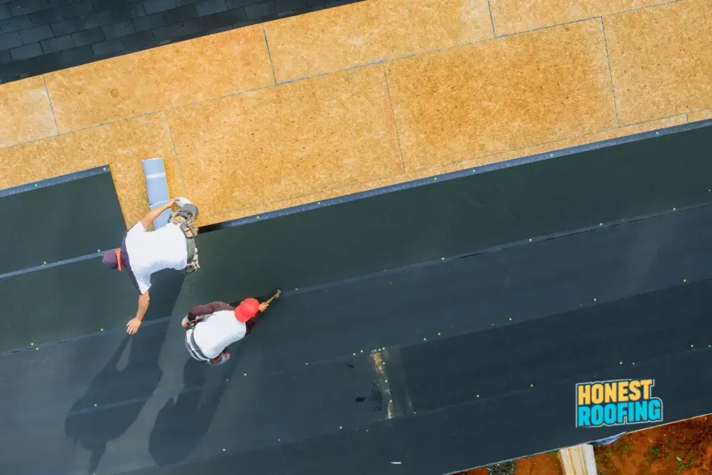 Commercial roofing Pennsylvania — property manager signing roofing contract document before approving 2026 project